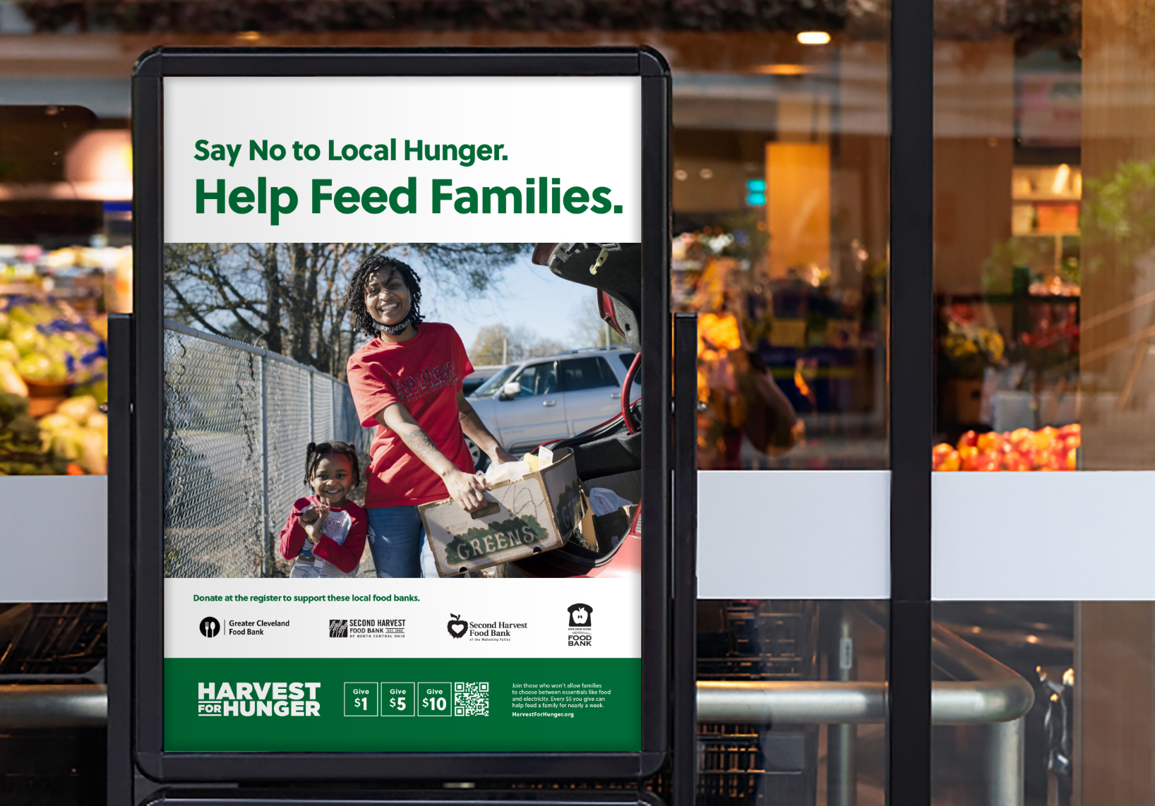grocery store with Harvest for Hunger standing poster