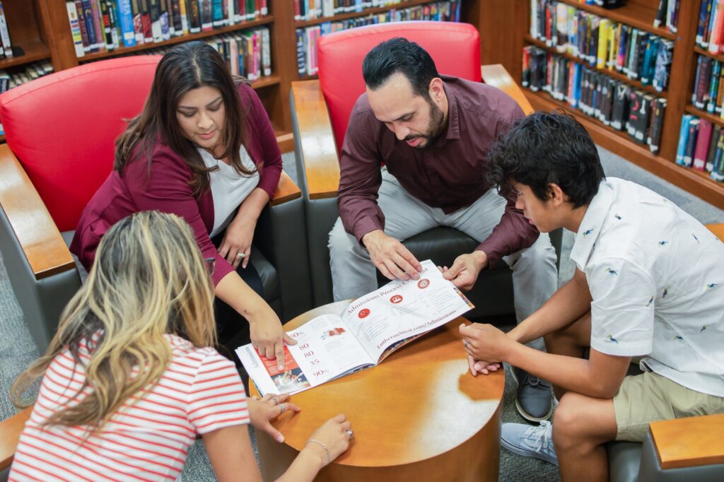 People collaborating around a table in a library