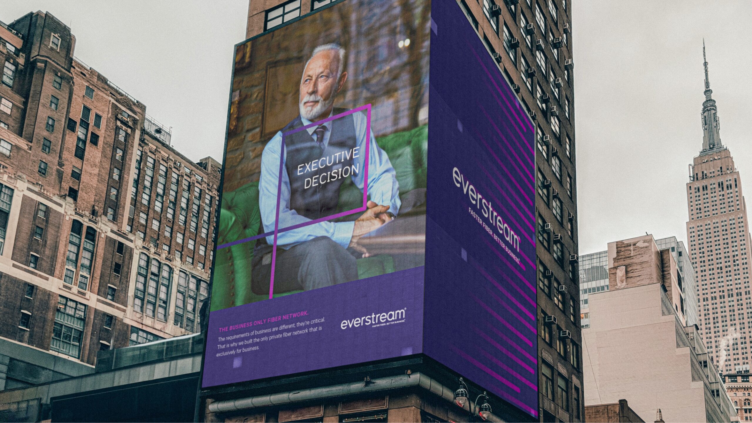 billboard of man in green chair on side of building
