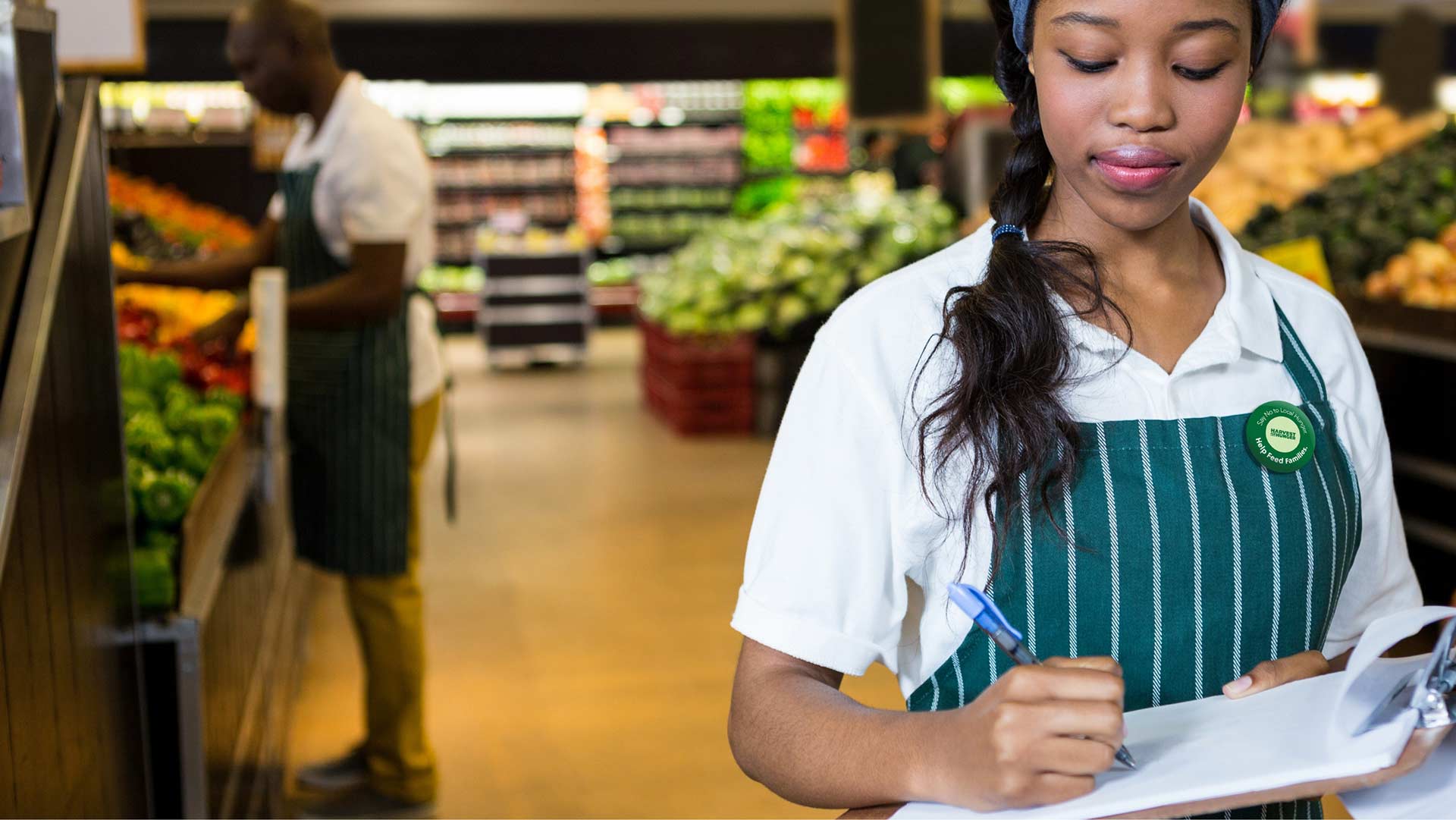 food pantry worker with a clipboard