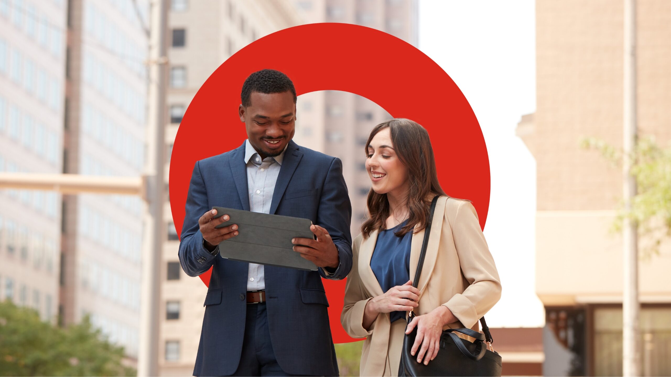 two people looking at an ipad