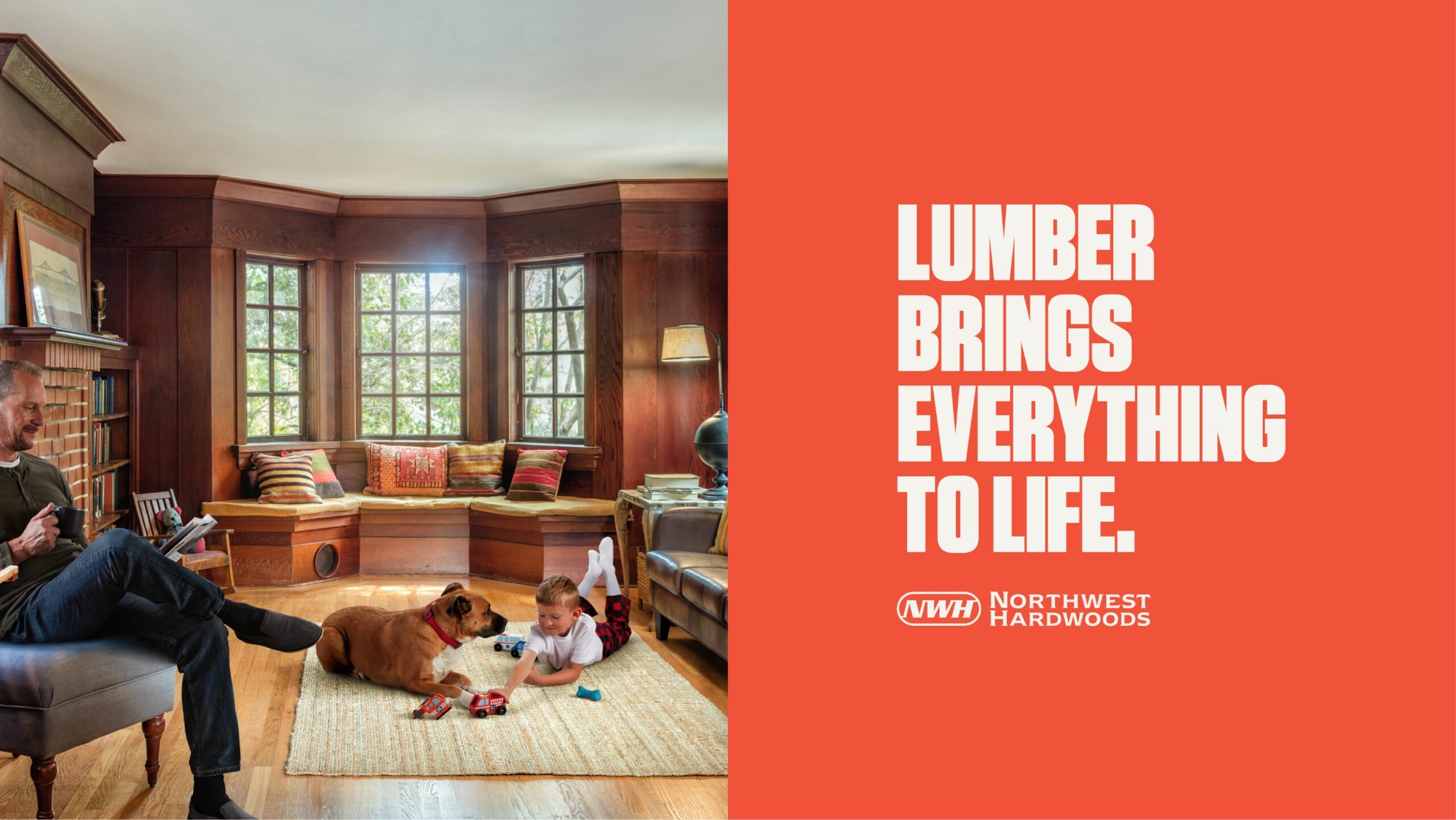dad and son in living room with dog