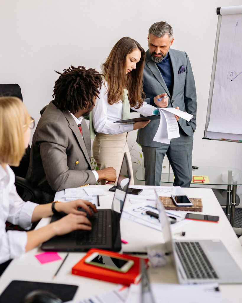 co-workers around conference table in meeting