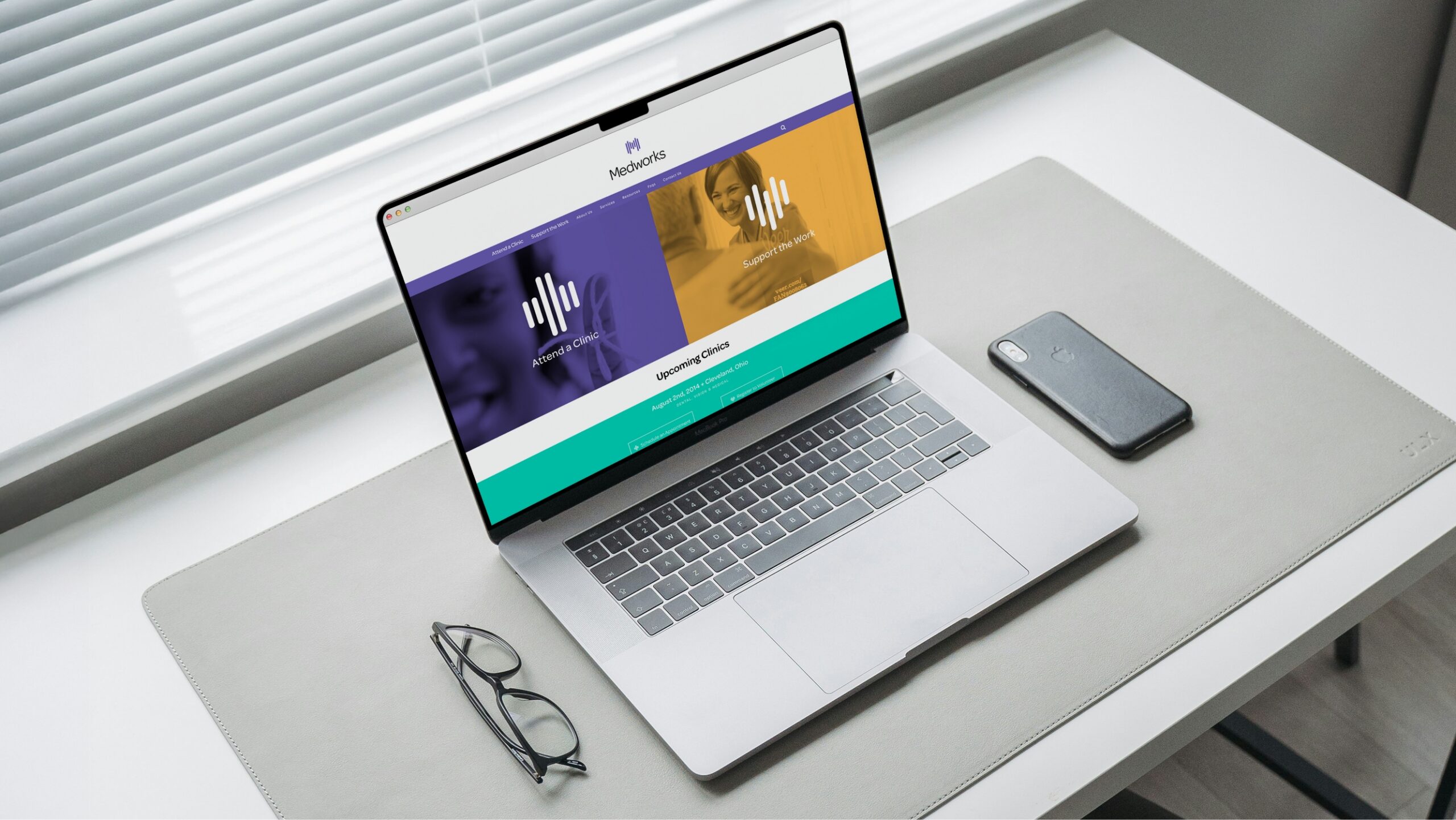 macbook on white desk