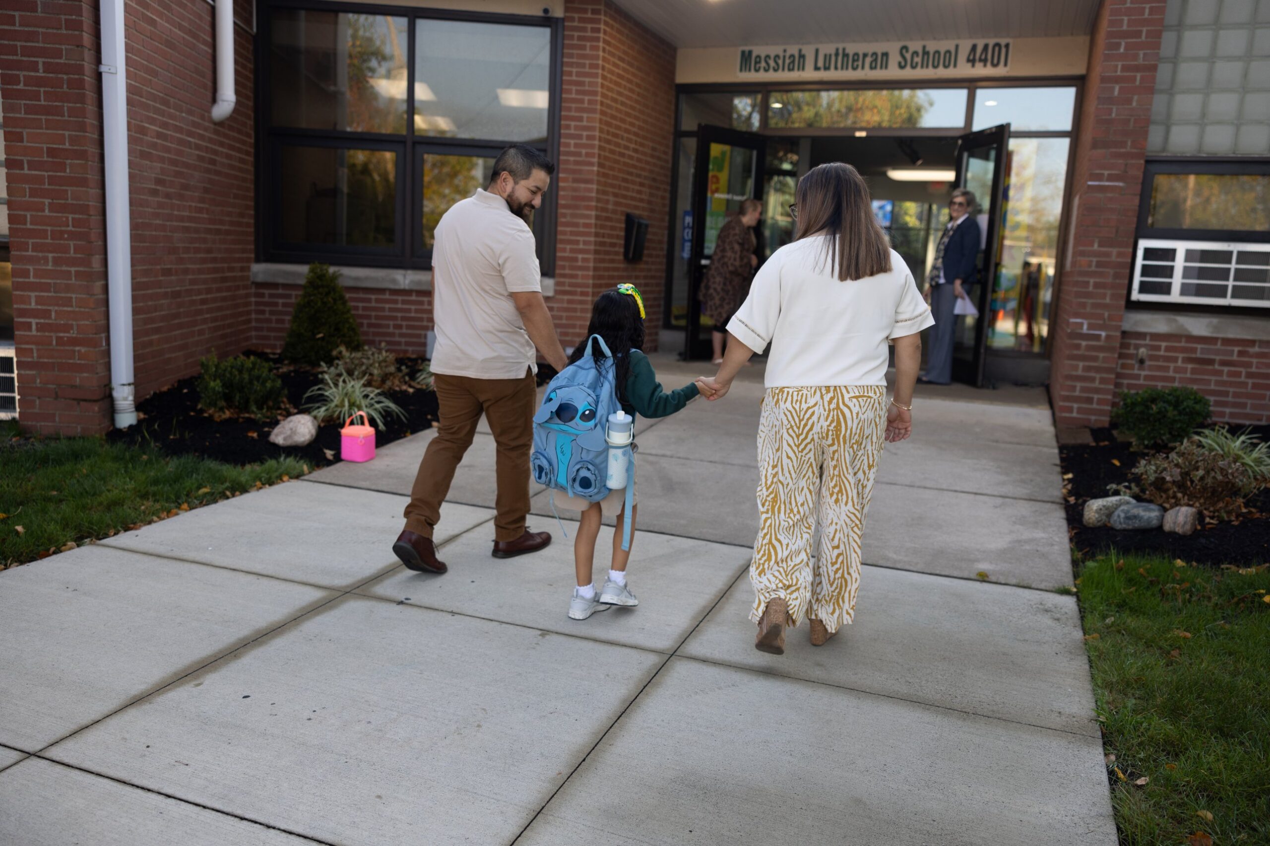 Parents walking their daughter into Messiah Lutheran School